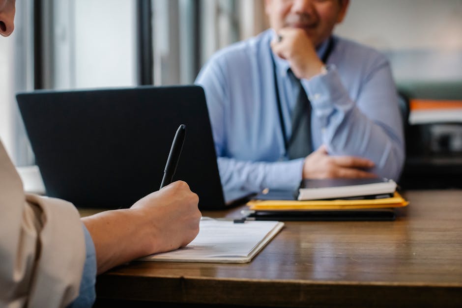 japanese man office interview business career thinking notebook