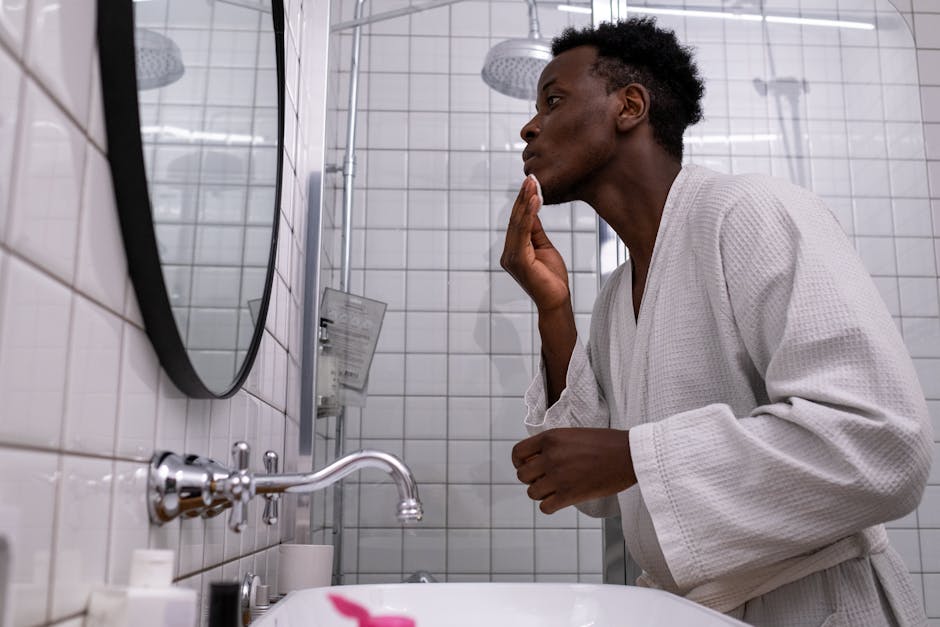 men skincare bottle bathroom morning routine (Photo by cottonbro studio via Pexels)