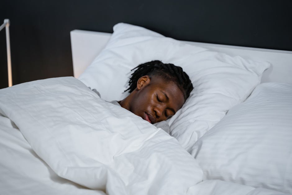 japanese man sleep tracking smartwatch bedroom night (Photo by MART PRODUCTION via Pexels)