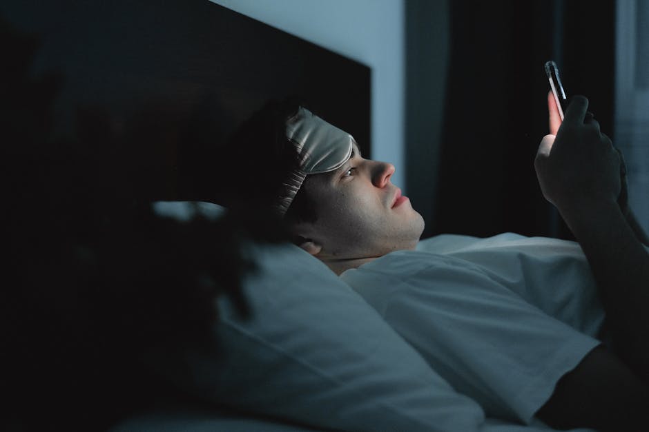 japanese man bedroom night phone smartwatch sleep tracking