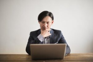 japanese businessman suit changing career 30s thinking office (Photo by Andrea Piacquadio via Pexels)