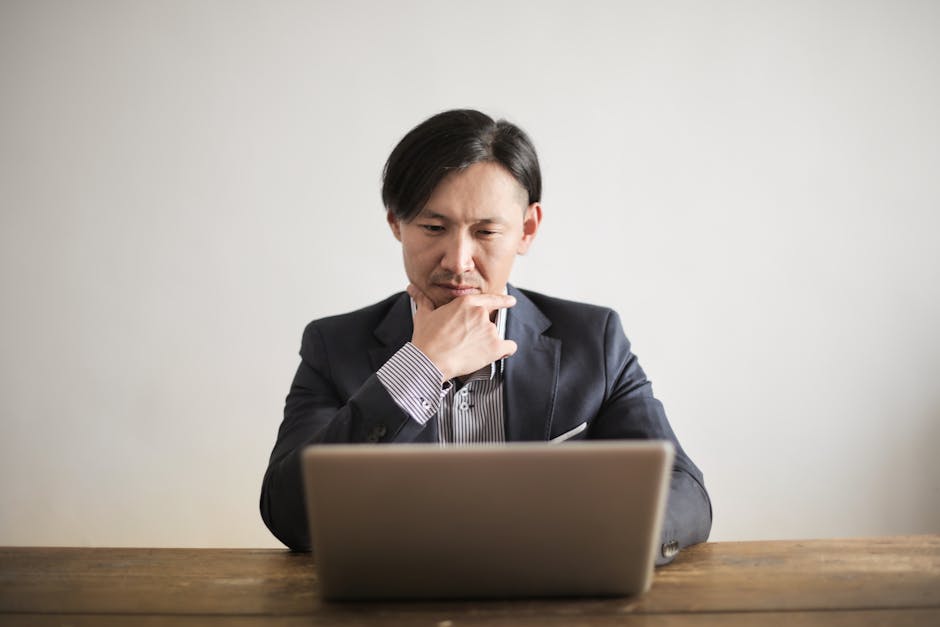 japanese businessman suit changing career 30s thinking office (Photo by Andrea Piacquadio via Pexels)