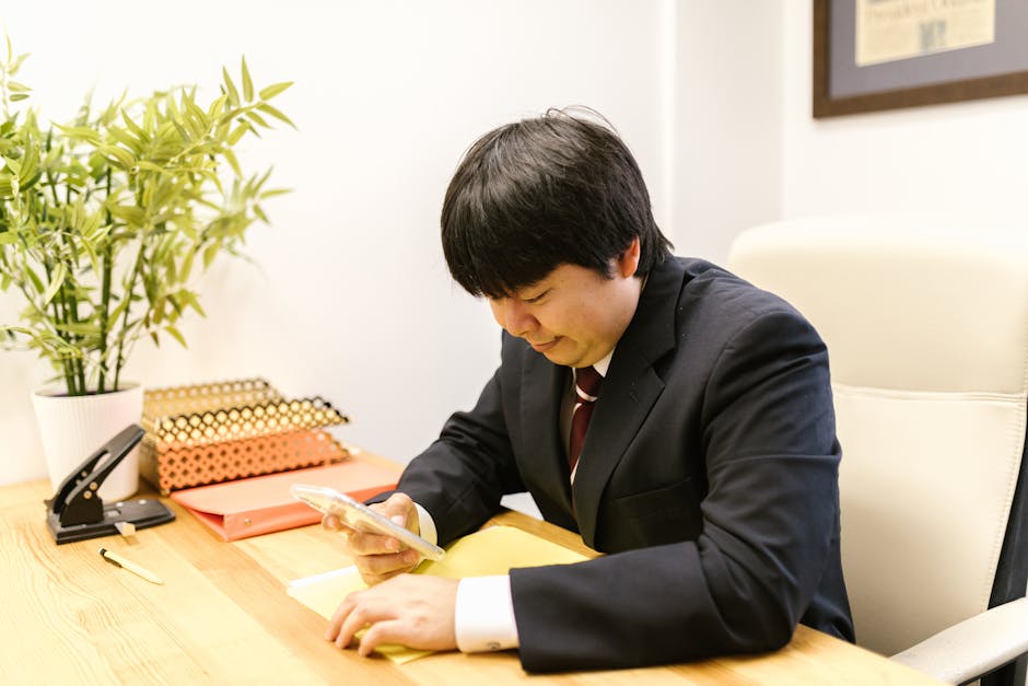 japanese man suit looking exhausted office window evening